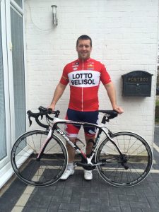 Dan Rosewell in cycling gear with his bicycle