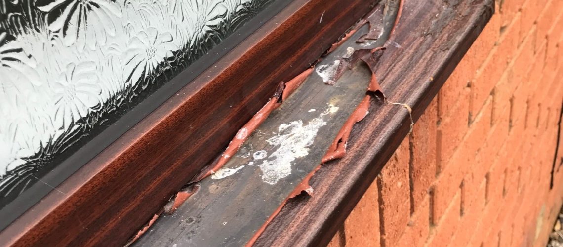 Peeling PVC foil on a window frame