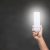 Man holding an illuminated eco-friendly light bulb